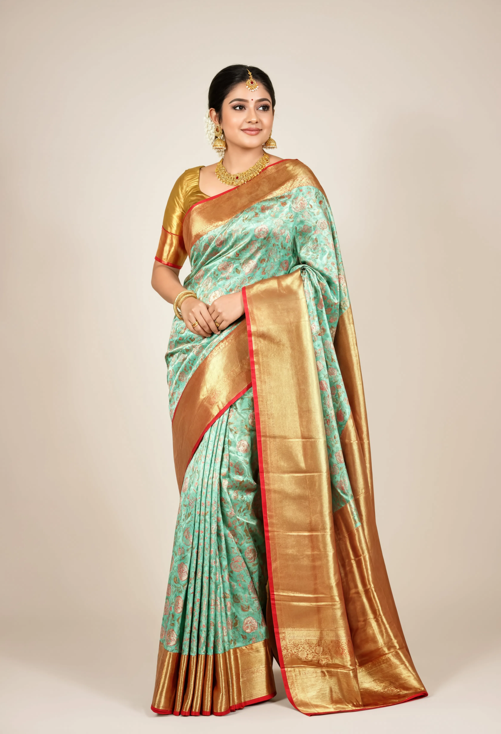 Model wearing a Gold and Mint Floral Saree from Siara
